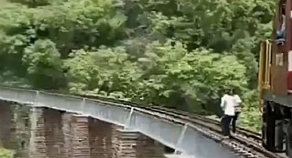Pareja salta de puente para no ser arrollados por un TREN, tomaban fotos de su boda